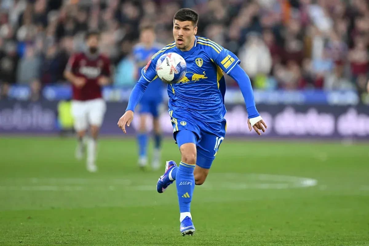 Player in blue kit controlling the ball during match Player in blue kit controlling the ball during match