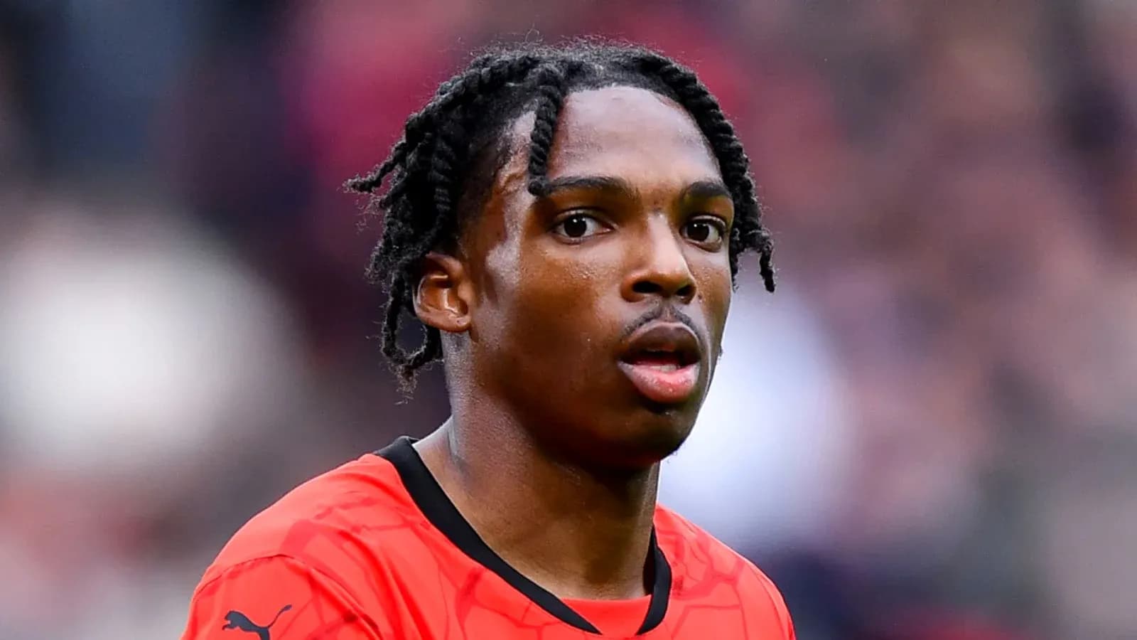 Player in red jersey during match Player in red jersey during match