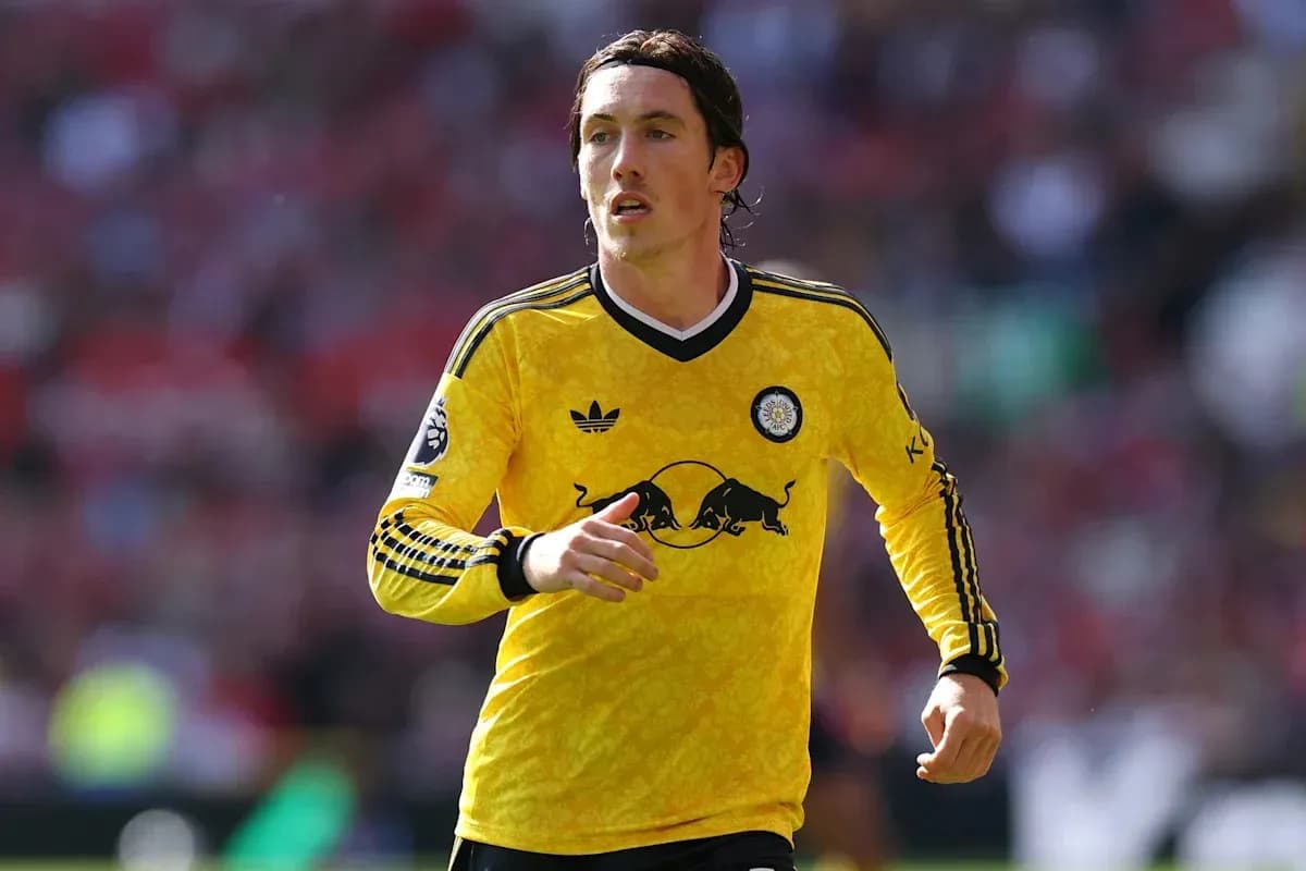 Player in yellow jersey running on the field Player in yellow jersey running on the field