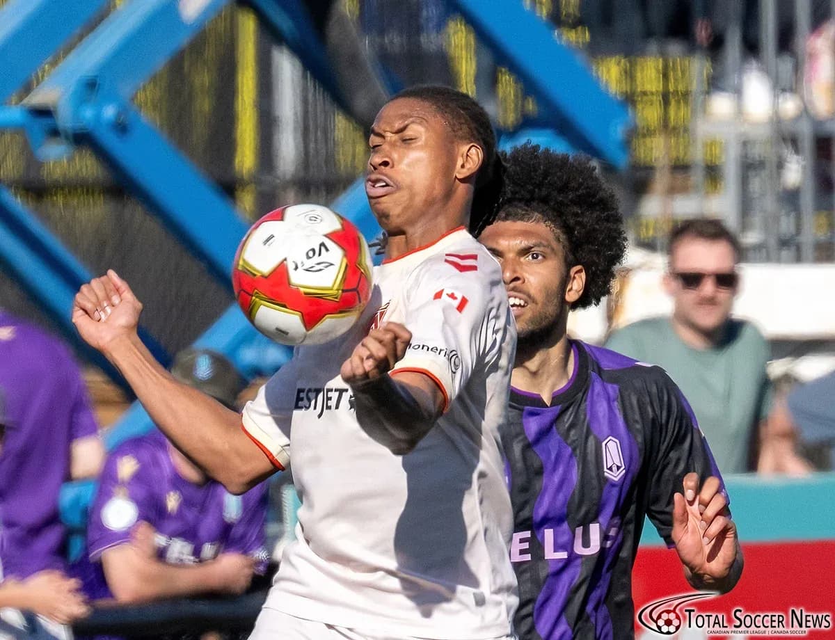 Cavalry FC player contesting for the ball Cavalry FC player contesting for the ball