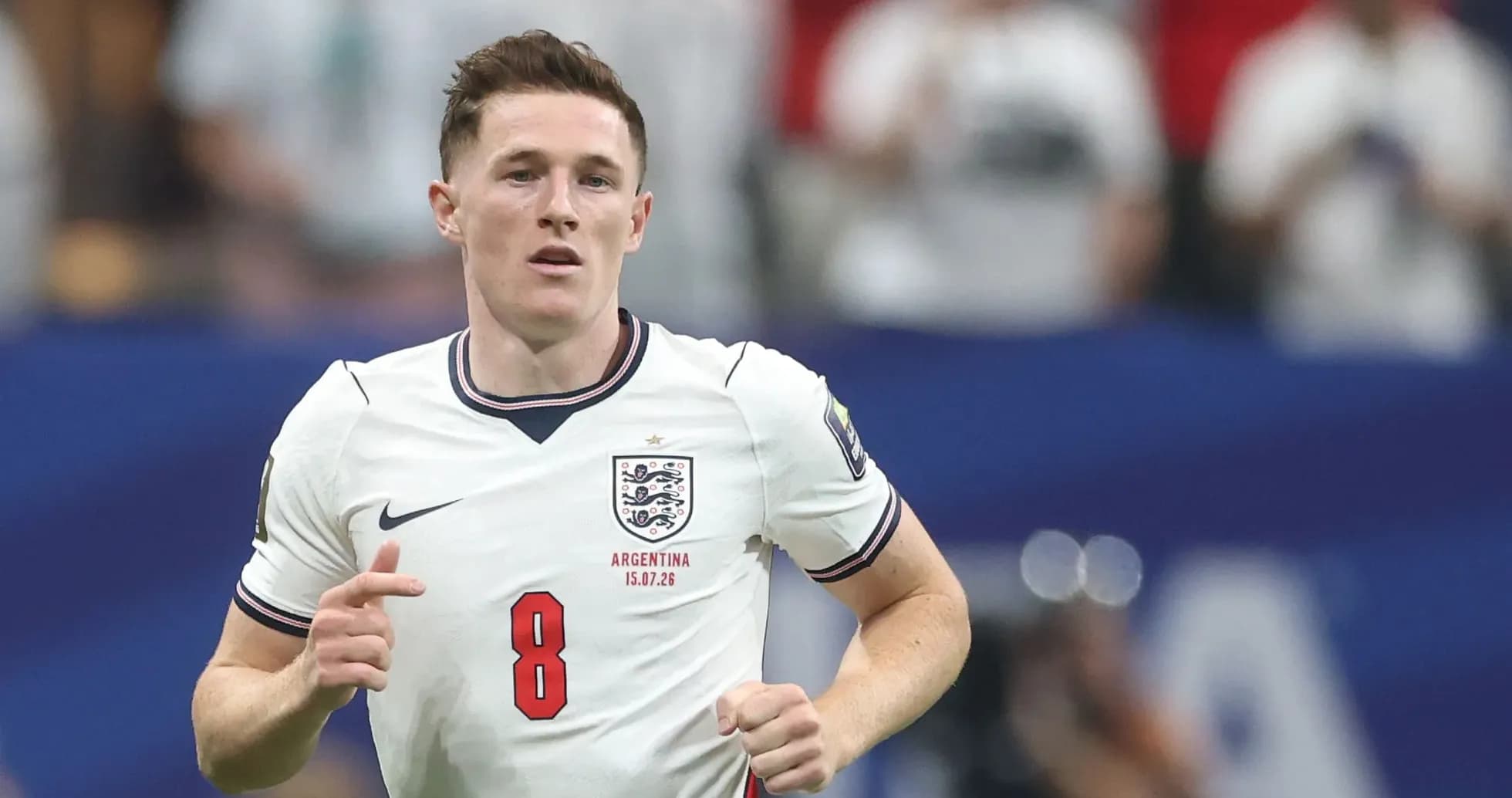 Player in England jersey running on the field Player in England jersey running on the field