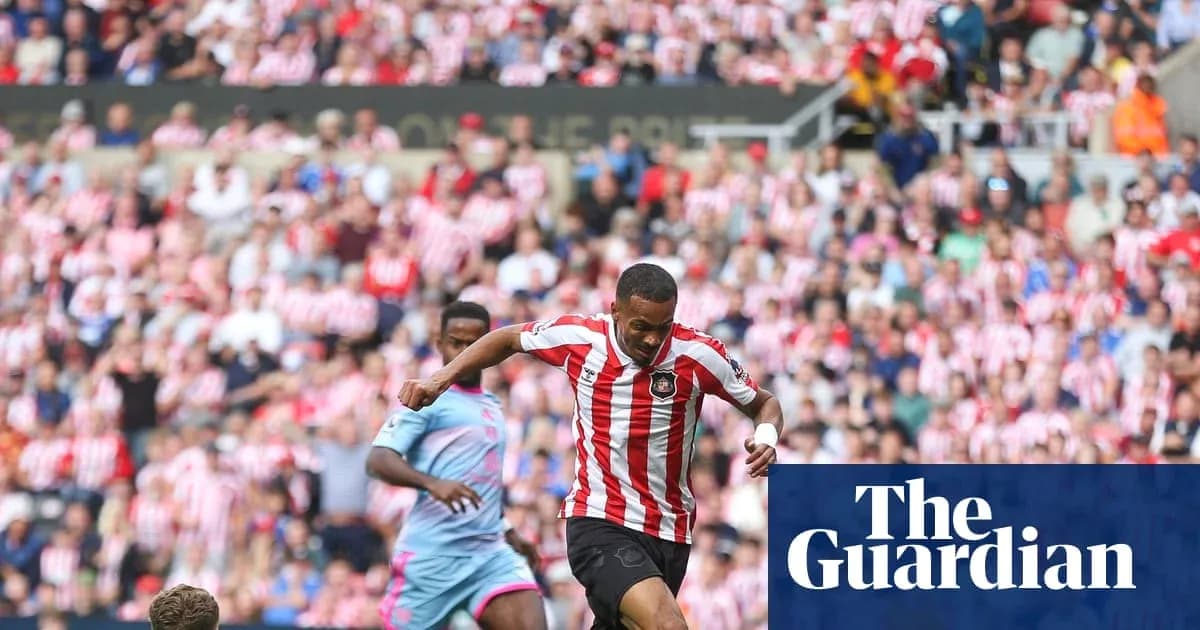 Player dribbling past opponent in a stadium Player dribbling past opponent in a stadium