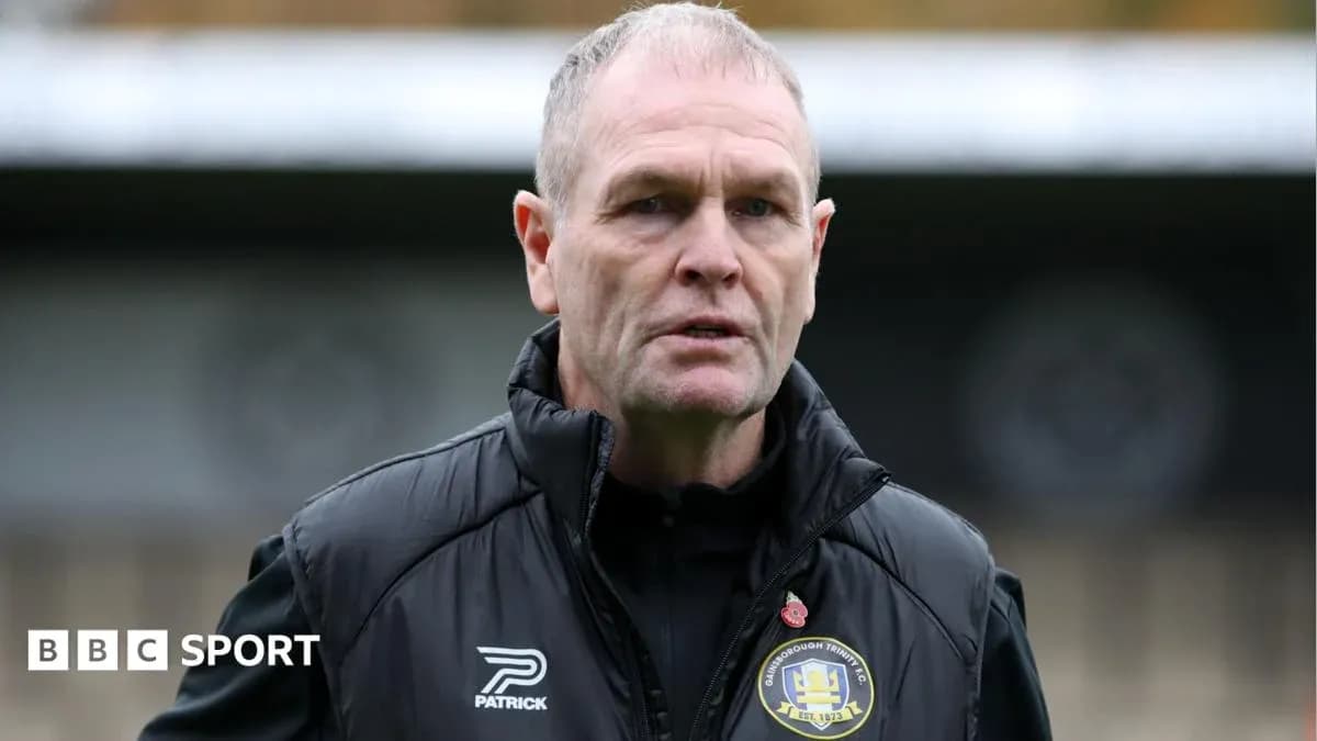 Manager in black jacket at training ground Manager in black jacket at training ground