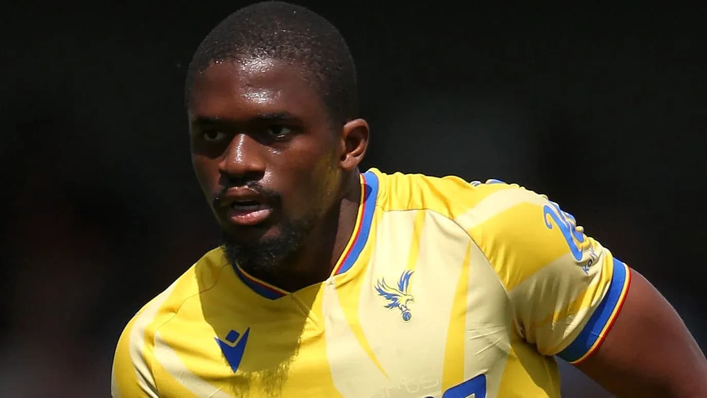 Player in yellow jersey running on the pitch Player in yellow jersey running on the pitch