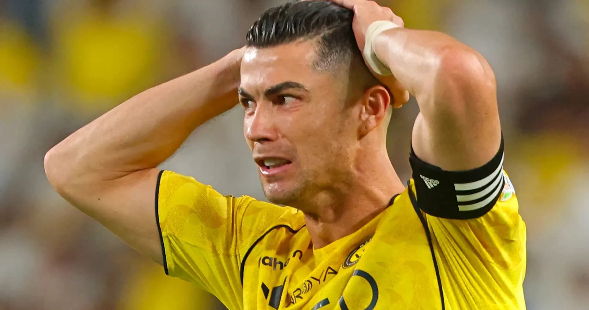 Player in yellow jersey reacting during a match Player in yellow jersey reacting during a match