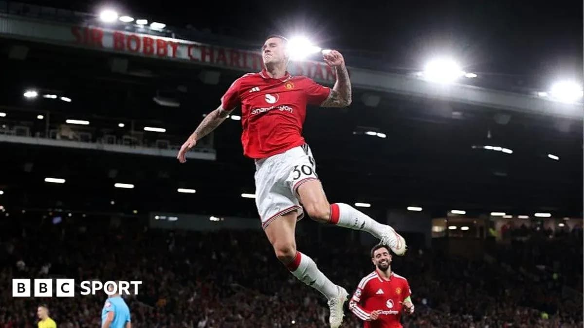 Player celebrating a goal at Old Trafford stadium Player celebrating a goal at Old Trafford stadium