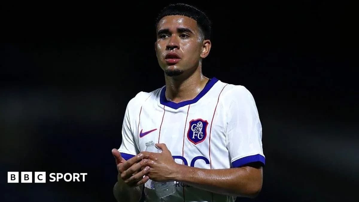 Player holding water bottle after match Player holding water bottle after match