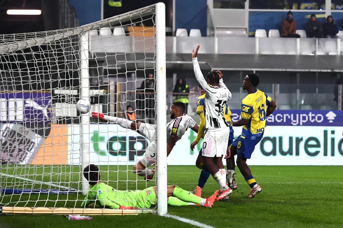 Goalkeeper attempts to save shot during Juventus match Goalkeeper attempts to save shot during Juventus match