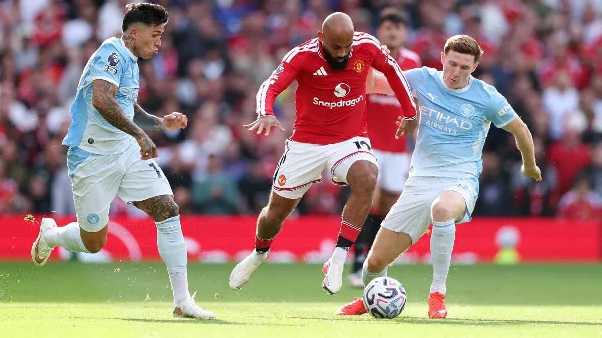 Players contesting for the ball during Manchester derby Players contesting for the ball during Manchester derby