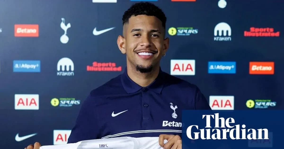 Player holding Tottenham Hotspur shirt at press conference Player holding Tottenham Hotspur shirt at press conference