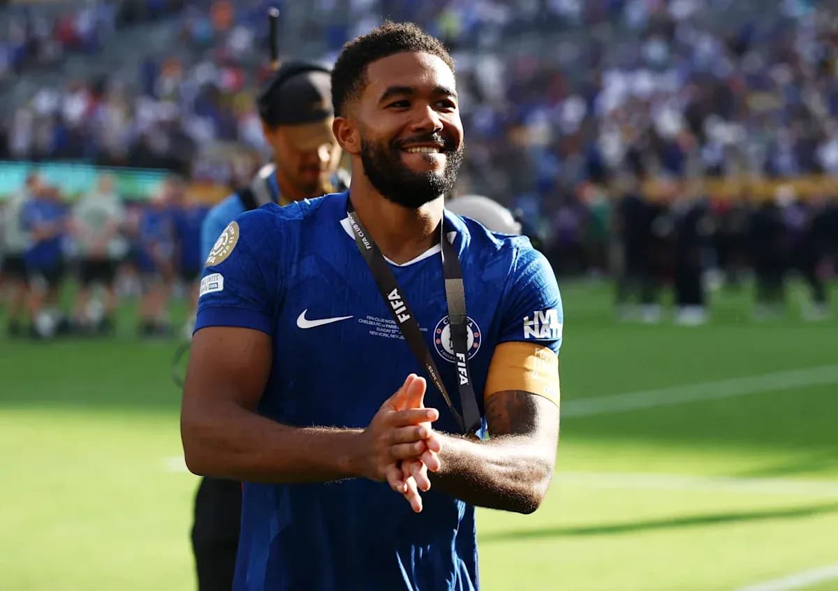 Player celebrating with medal on the field Player celebrating with medal on the field