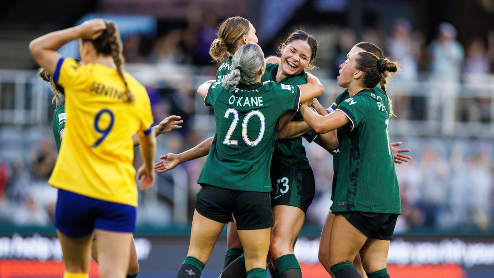 Players celebrating a goal during match Players celebrating a goal during match