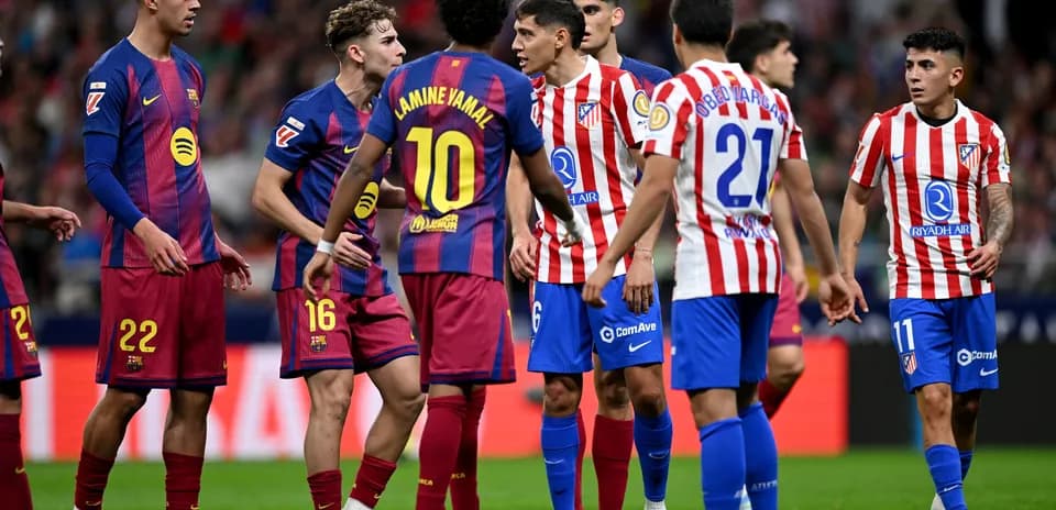 Players from Barcelona and Atletico Madrid in discussion Players from Barcelona and Atletico Madrid in discussion