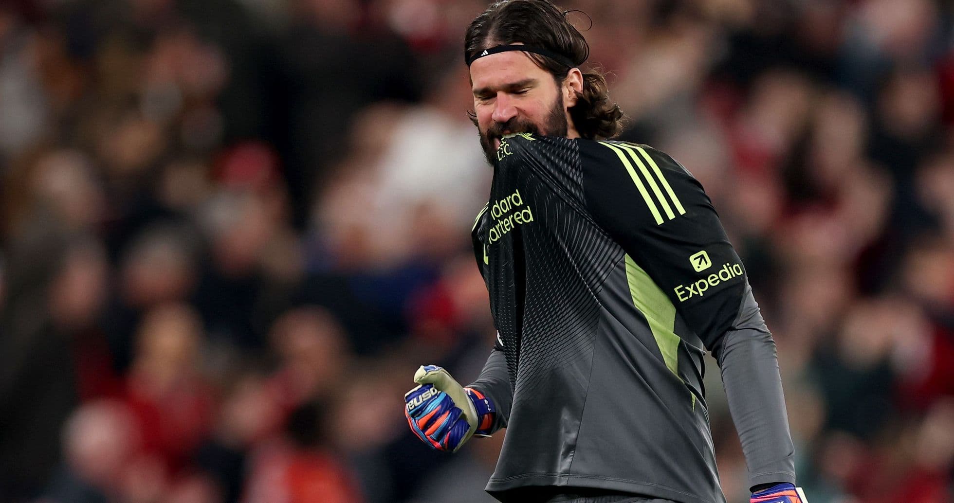 Goalkeeper celebrating during a match with fans Goalkeeper celebrating during a match with fans