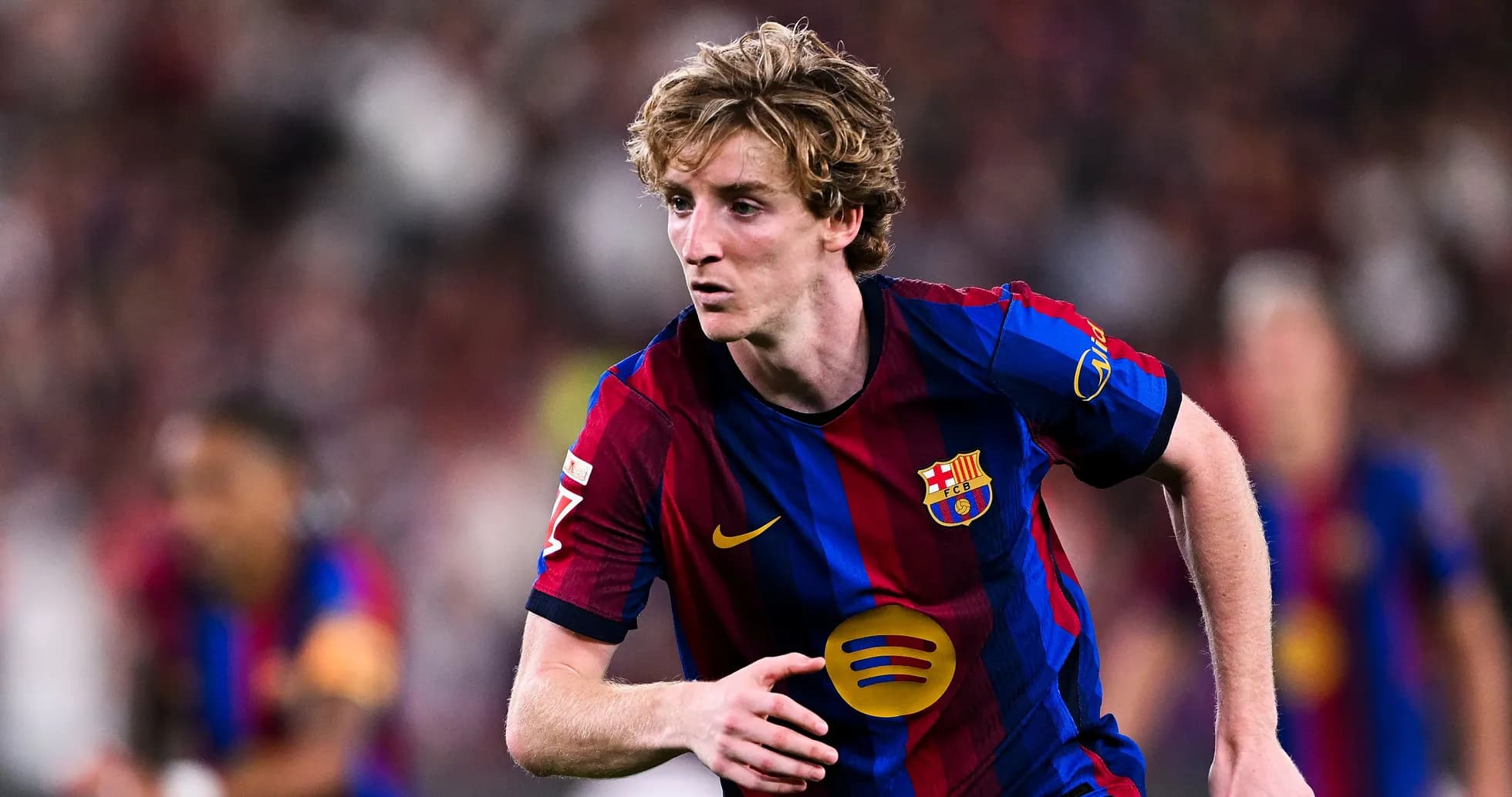 FC Barcelona player sprinting during a match FC Barcelona player sprinting during a match
