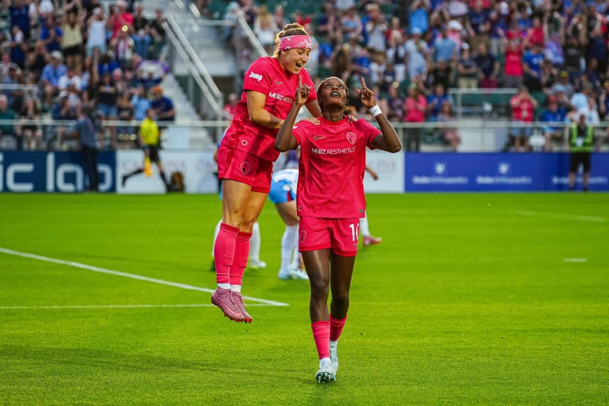 Players celebrating a goal during NWSL match Players celebrating a goal during NWSL match