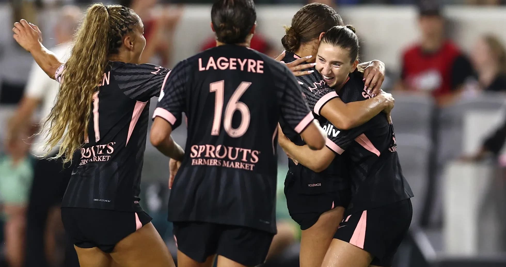 Players celebrating a goal during NWSL match Players celebrating a goal during NWSL match