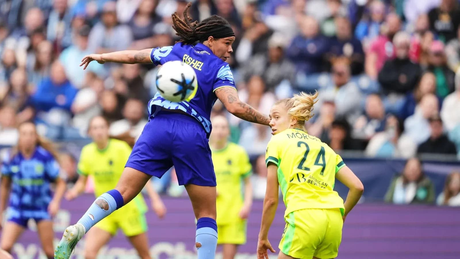 Player competing for the ball during NWSL match Player competing for the ball during NWSL match