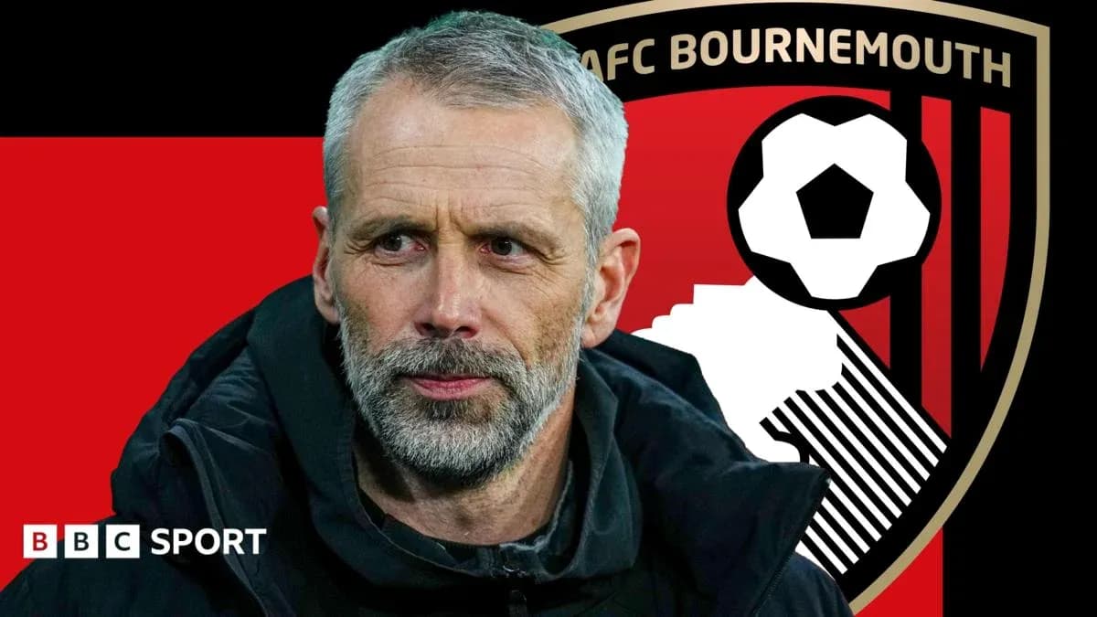 AFC Bournemouth manager with club logo background AFC Bournemouth manager with club logo background