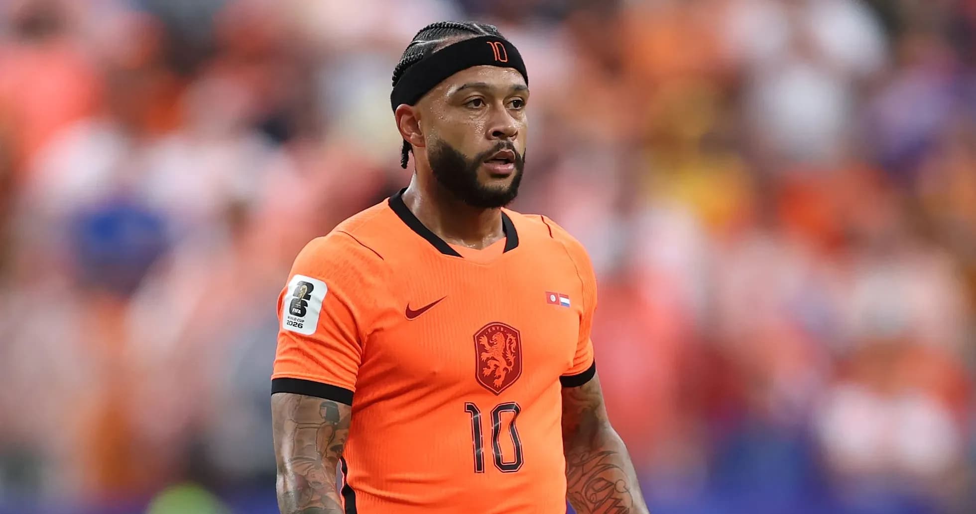 Player in orange jersey during match action Player in orange jersey during match action
