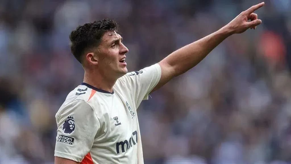 Player signaling during a football match Player signaling during a football match