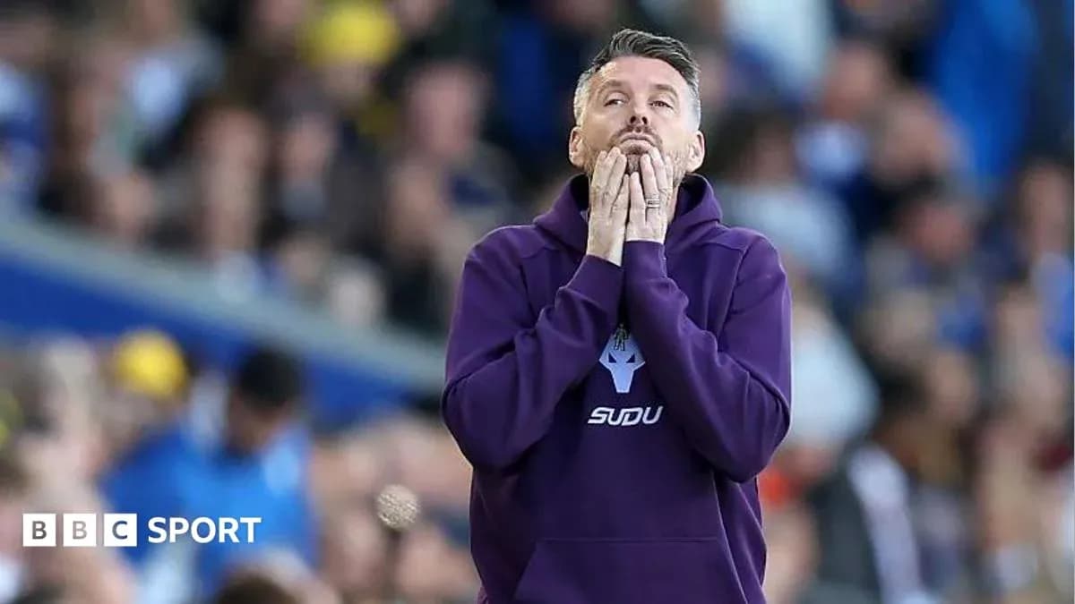 Coach with hands on face during match Coach with hands on face during match