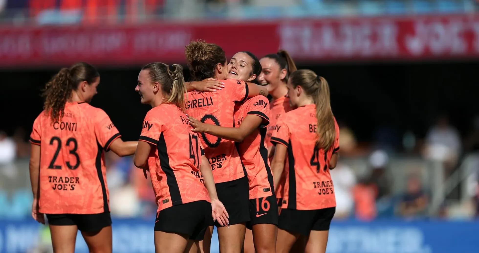 Players celebrating a goal during match Players celebrating a goal during match