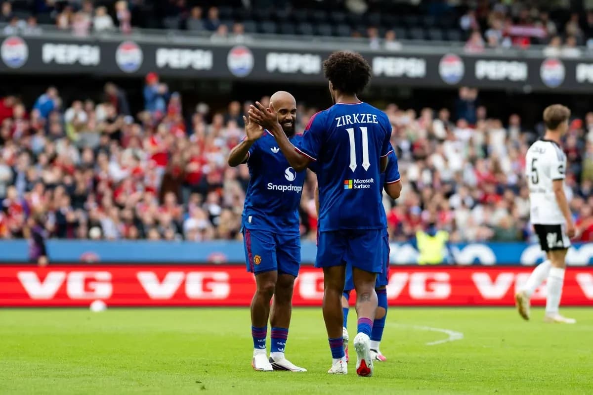 Two players celebrating during a football match Two players celebrating during a football match