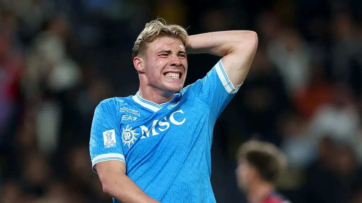 Player in blue jersey reacting during a match Player in blue jersey reacting during a match