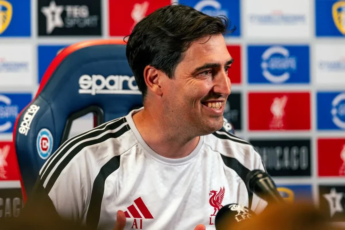 Manager speaking at press conference with Liverpool backdrop Manager speaking at press conference with Liverpool backdrop