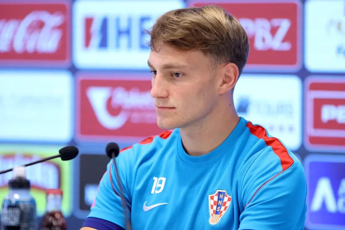 Player at press conference wearing Croatia training kit Player at press conference wearing Croatia training kit