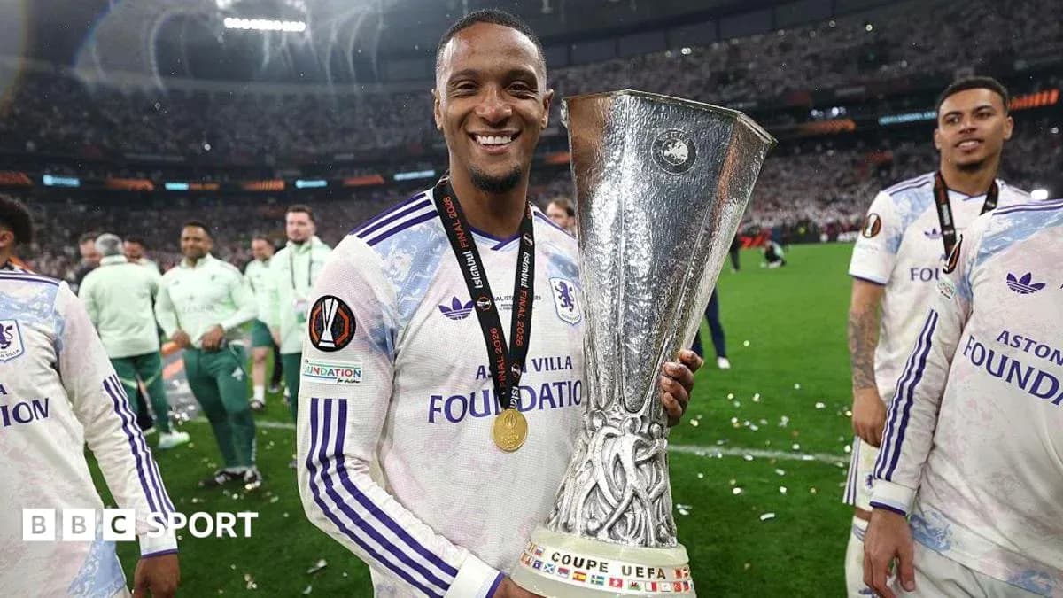 Player celebrating with UEFA Europa League trophy Player celebrating with UEFA Europa League trophy