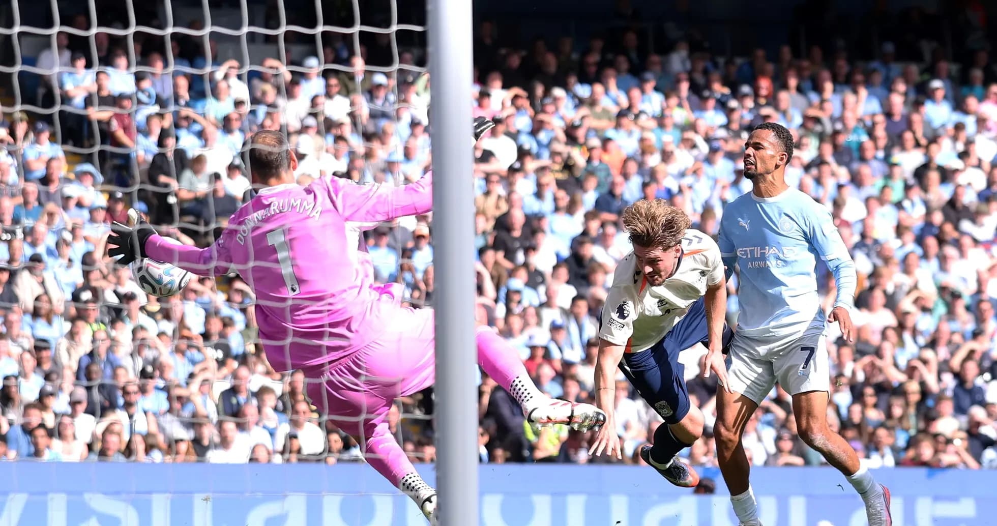 Goalkeeper saving a shot during football match Goalkeeper saving a shot during football match