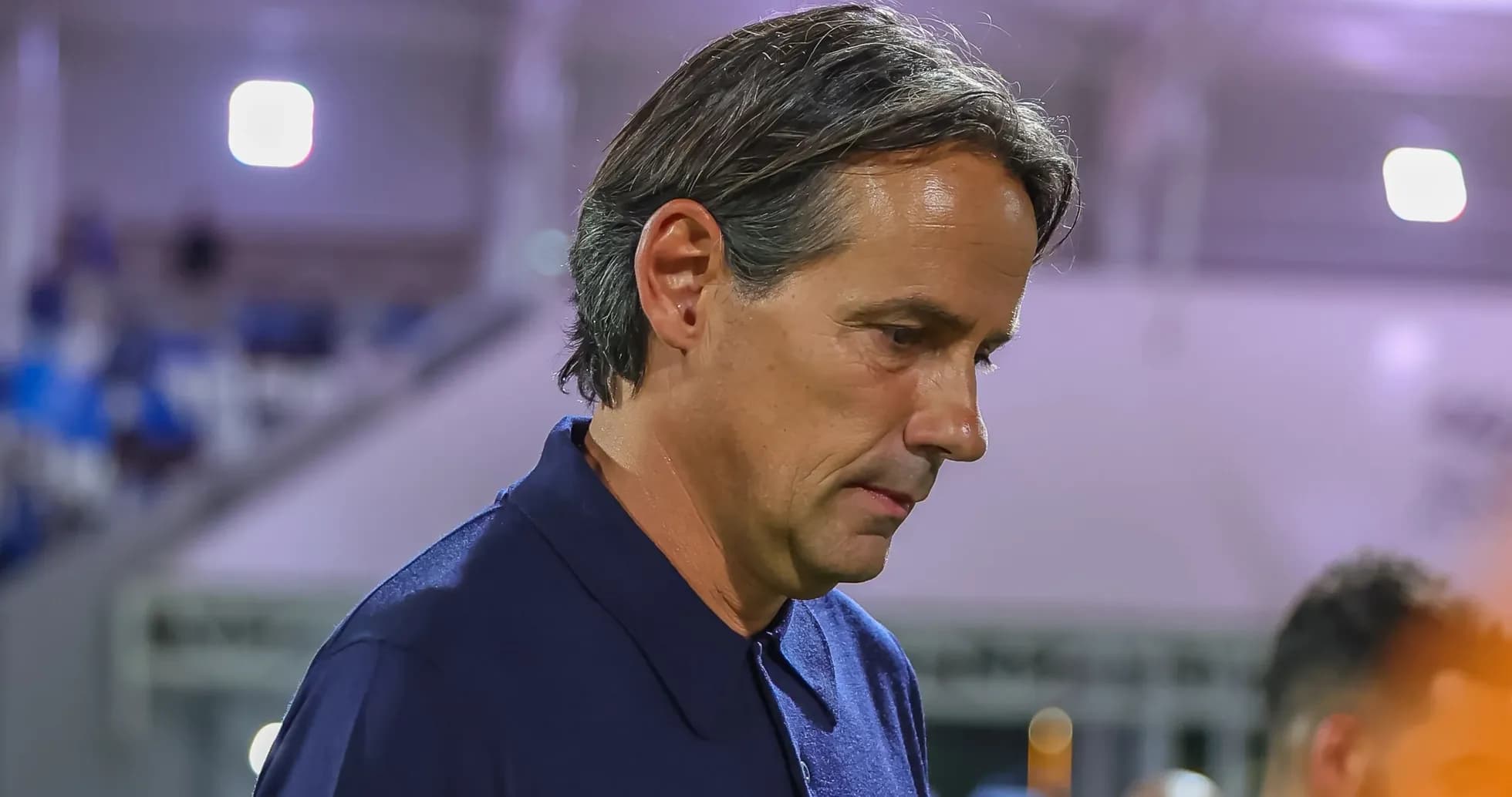 Coach walking on the sidelines during match Coach walking on the sidelines during match