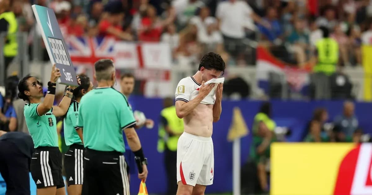 Player wiping sweat during substitution in match Player wiping sweat during substitution in match