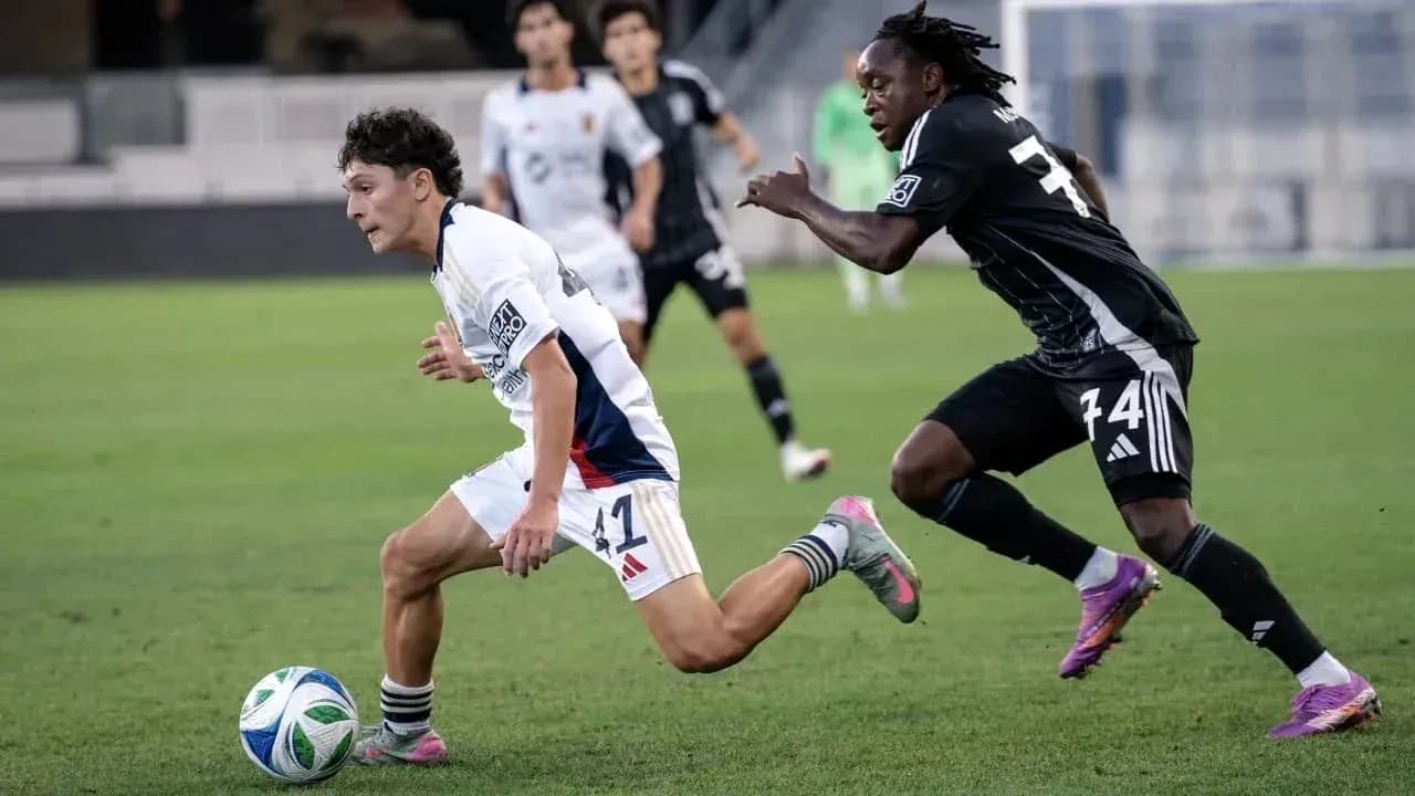 Player dribbling the ball during MLS Next Pro match Player dribbling the ball during MLS Next Pro match
