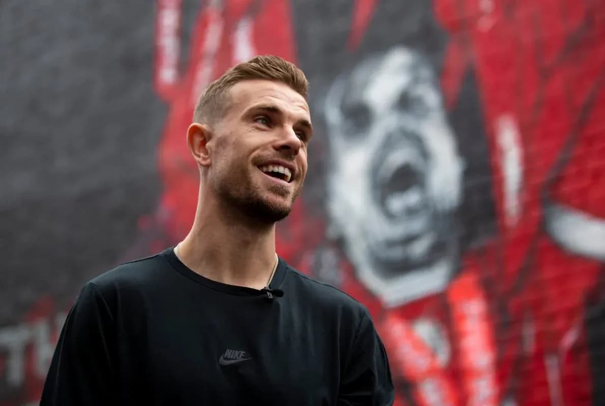 Player smiling in front of a mural background Player smiling in front of a mural background
