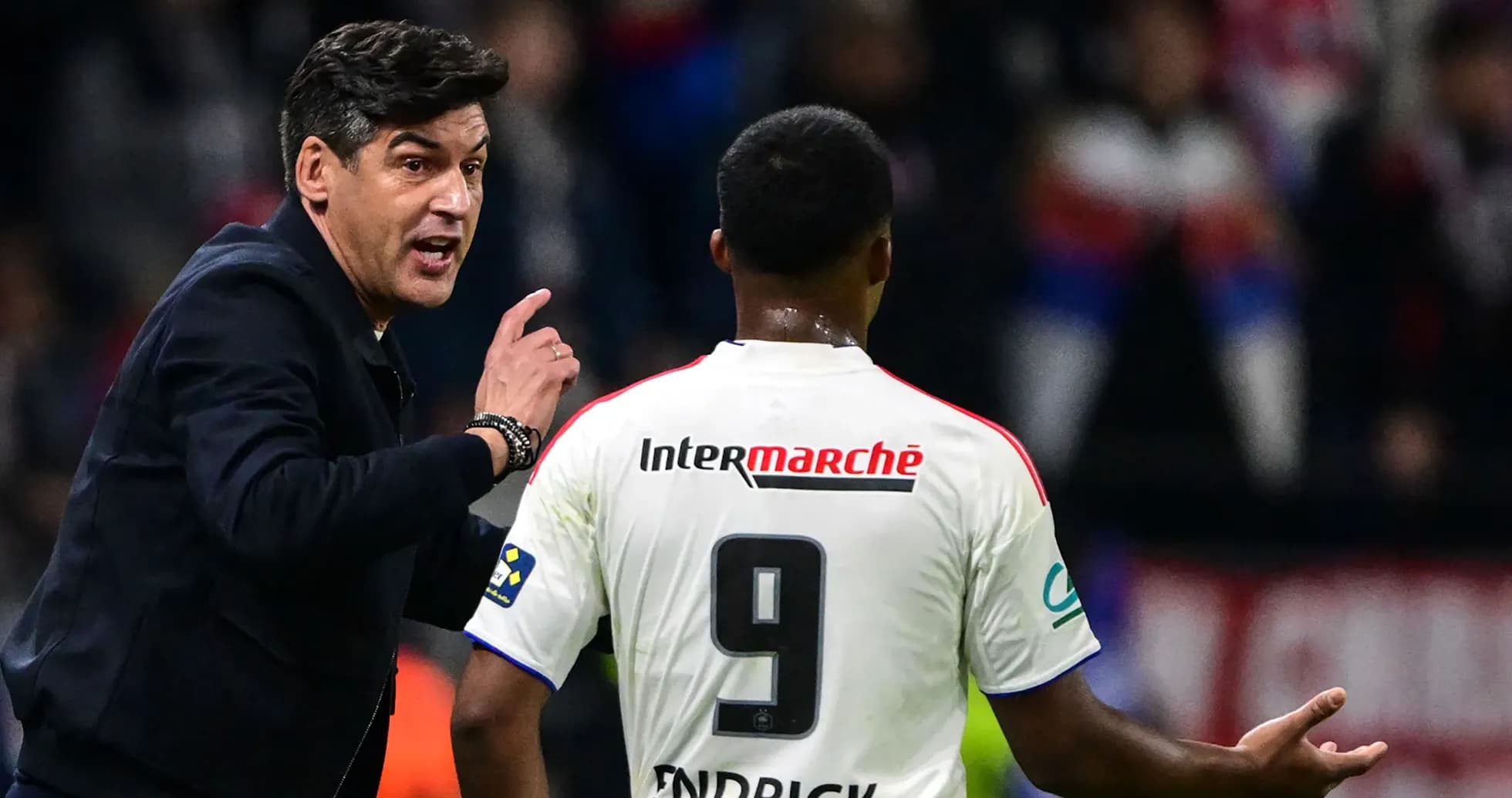 Coach giving instructions to player on the field Coach giving instructions to player on the field