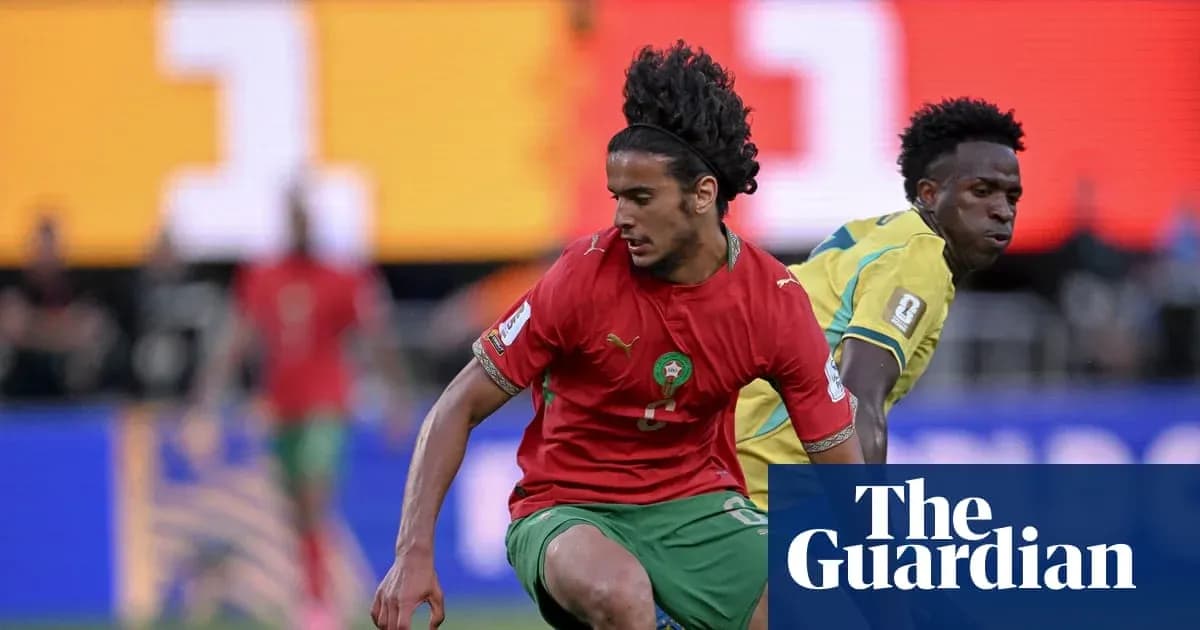 Morocco player dribbling past opponent during match Morocco player dribbling past opponent during match