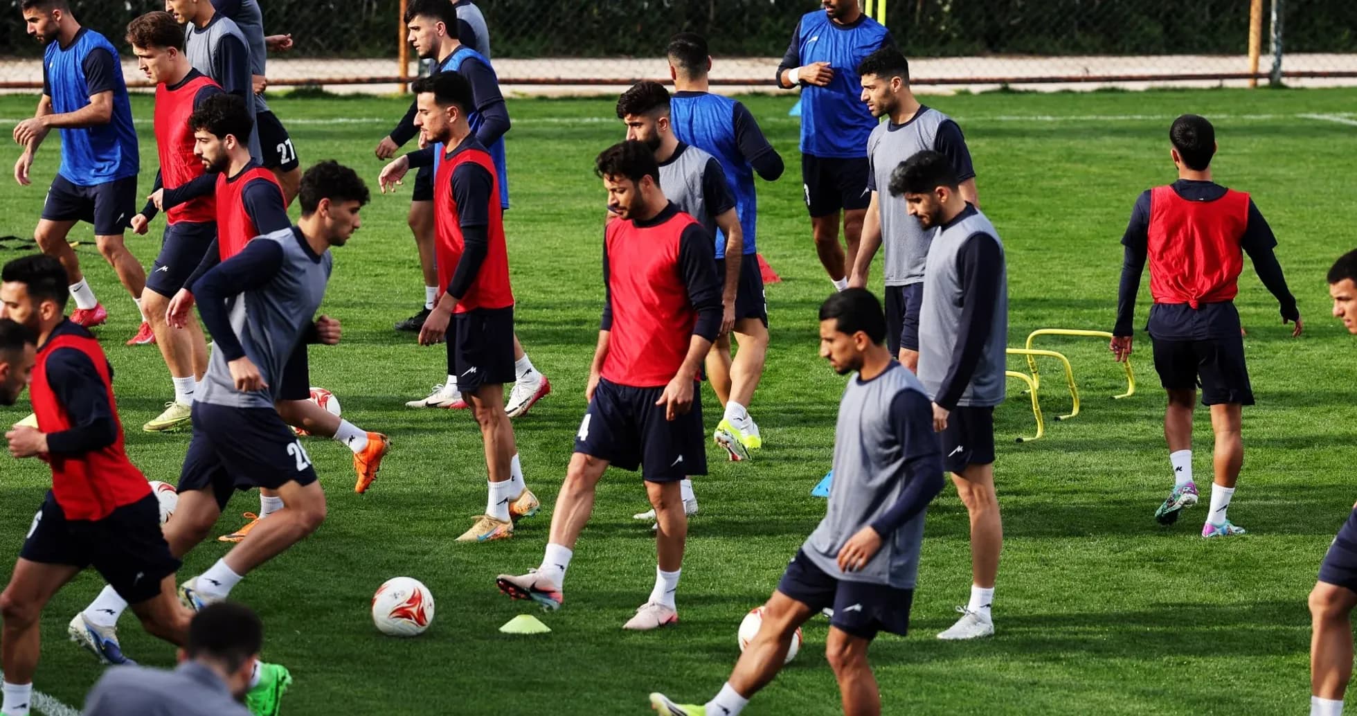 Players training on the pitch in practice session Players training on the pitch in practice session