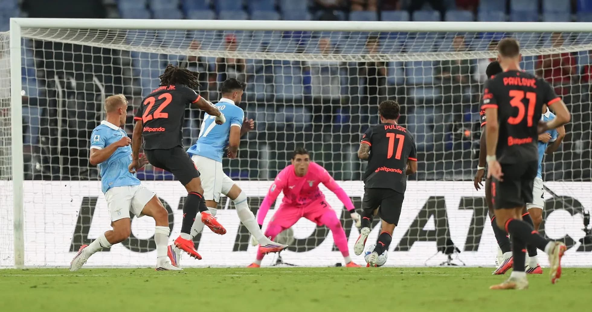 Lazio player attempts to score against AC Milan Lazio player attempts to score against AC Milan