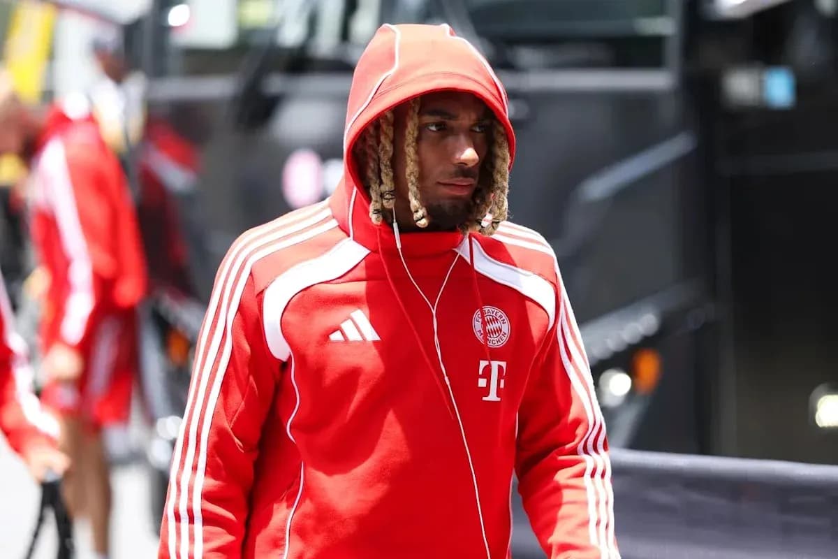 Player in red Bayern Munich hoodie arriving at venue Player in red Bayern Munich hoodie arriving at venue