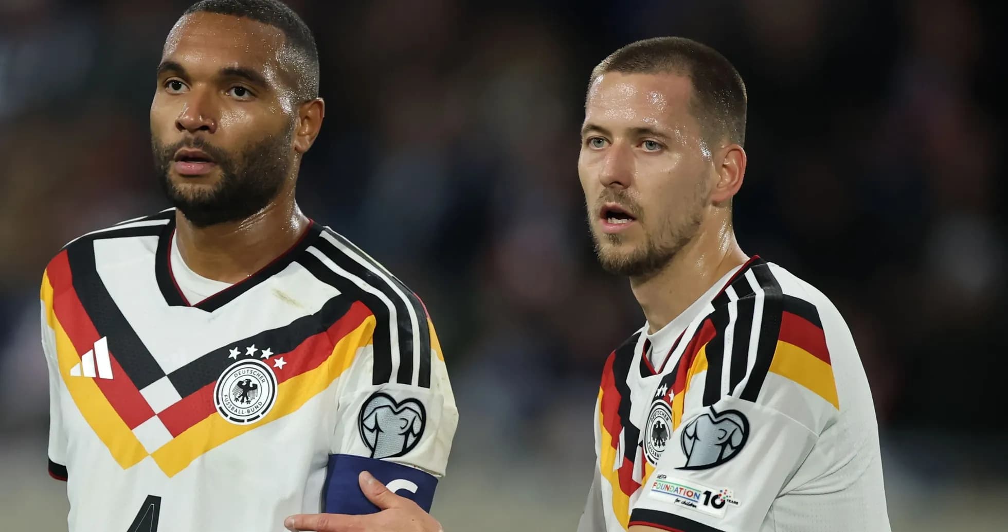 Two German players discussing during a match Two German players discussing during a match