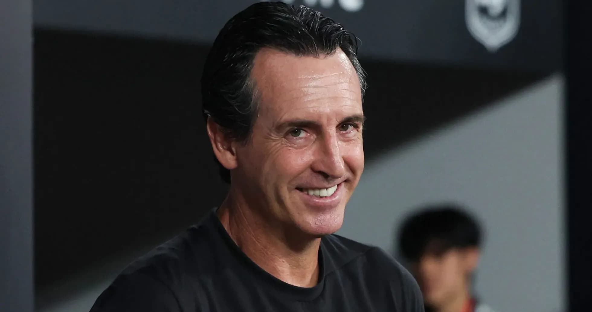 Coach smiling on the sidelines during match Coach smiling on the sidelines during match