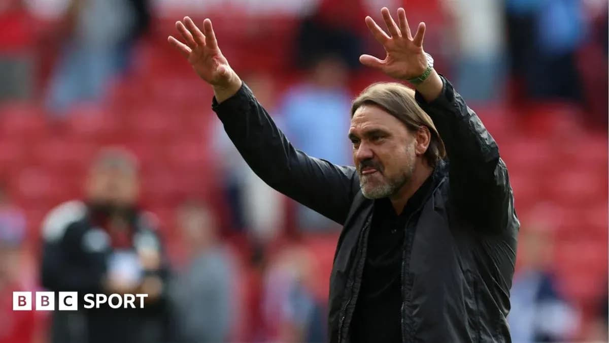 Manager gesturing to fans in stadium Manager gesturing to fans in stadium