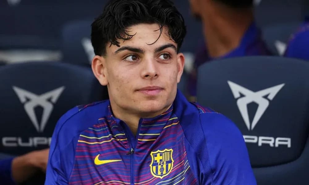 Barcelona player seated on bench during match Barcelona player seated on bench during match