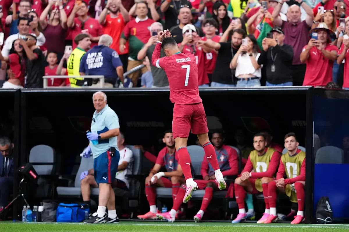 Player celebrating with fans during match Player celebrating with fans during match
