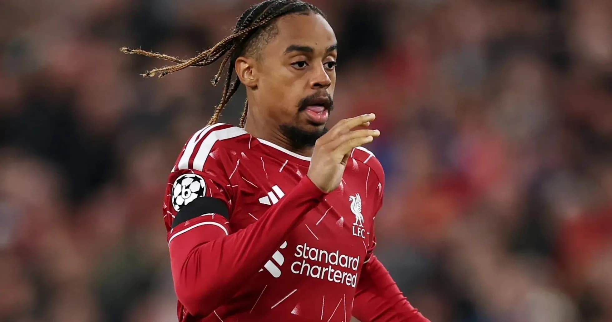 Player running during a Champions League match Player running during a Champions League match