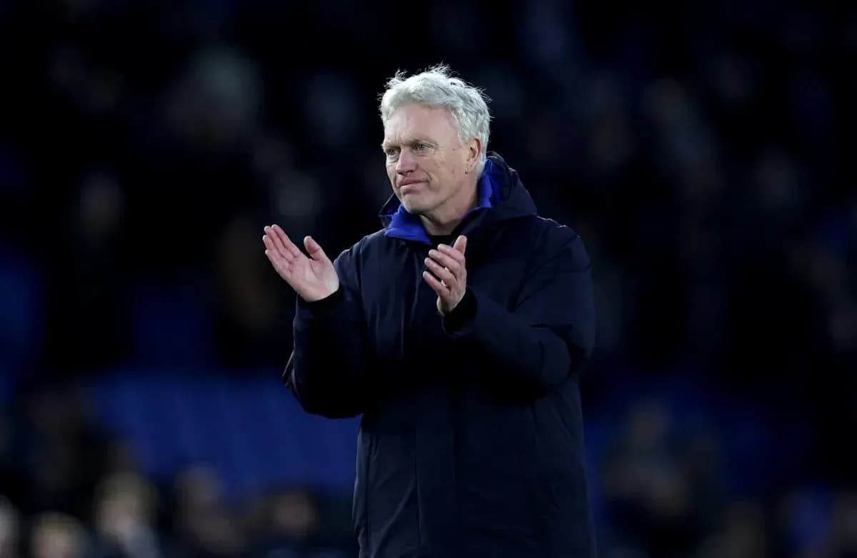 Manager applauding fans after match conclusion Manager applauding fans after match conclusion