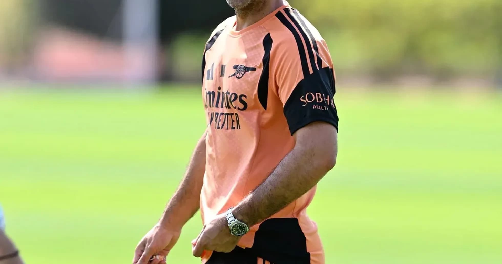 Coach smiling while holding a training device Coach smiling while holding a training device